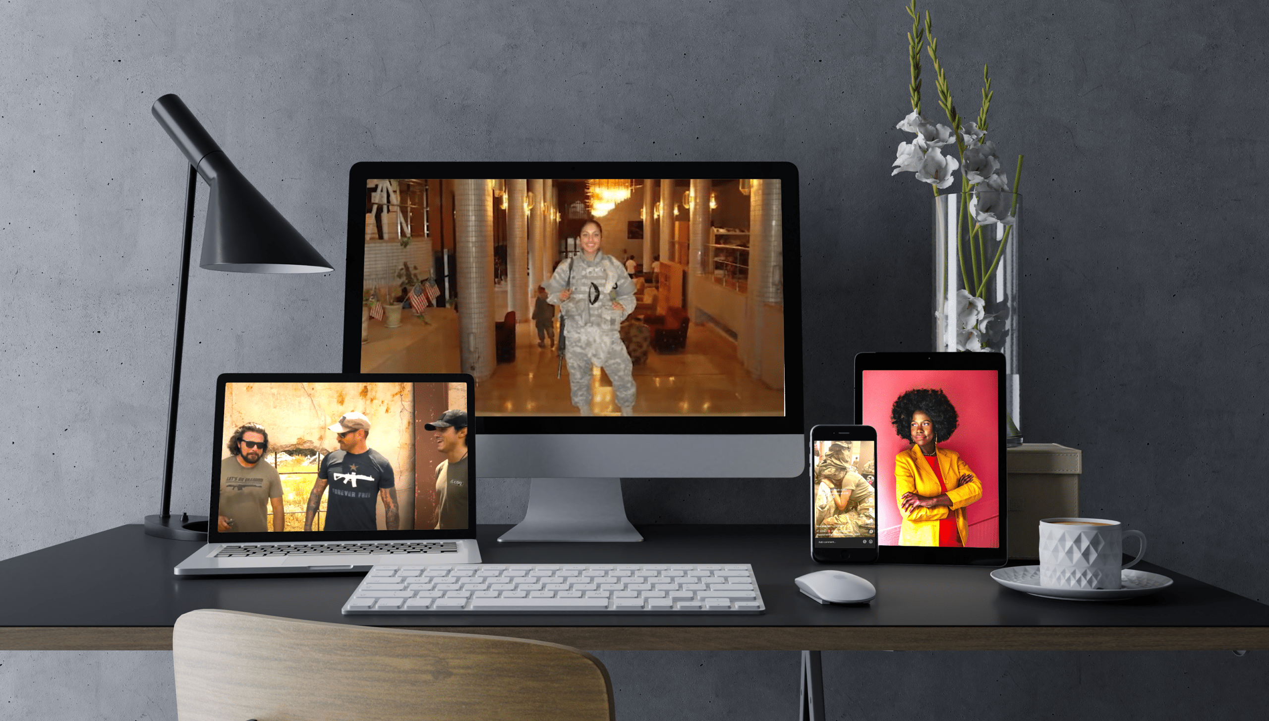 A desktop computer, laptop, computer, tablet, and phone show images of veteran and military social media influencers.