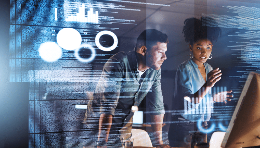 A man and a woman look at an image on a screen with a stylized tech overlay.