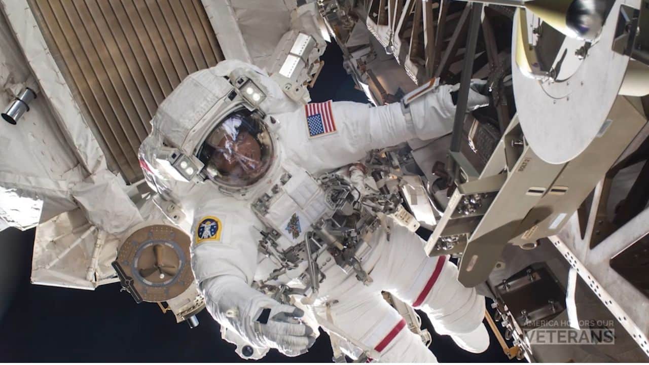 Christopher Cassidy with his astronaut space suit on in space.