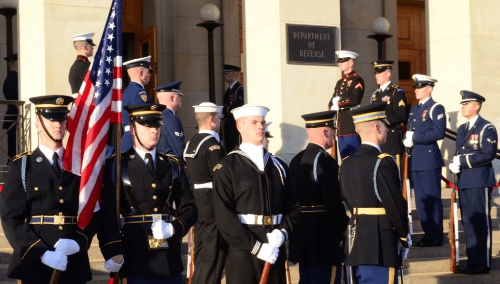 A group of soldiers stand at attention.