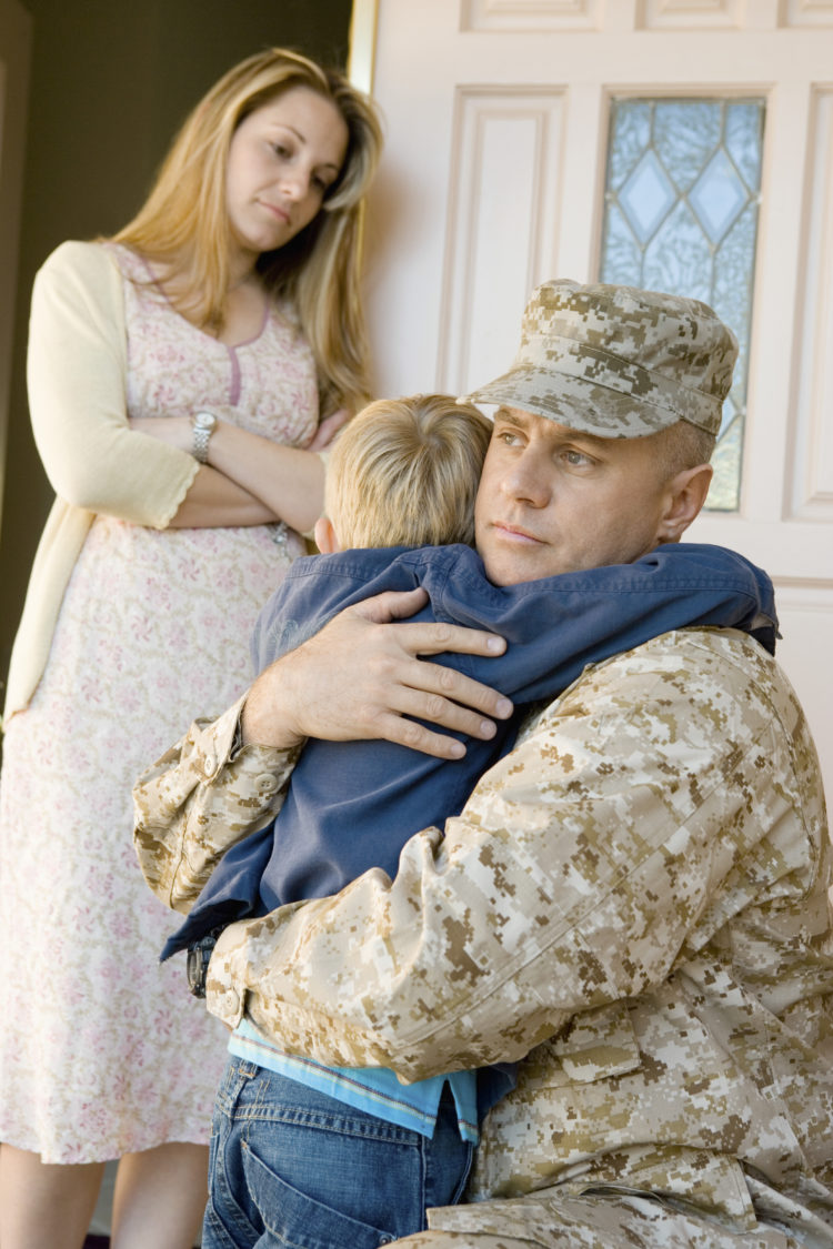 Soldier Embracing Son Before Departing While Mother Looking At T